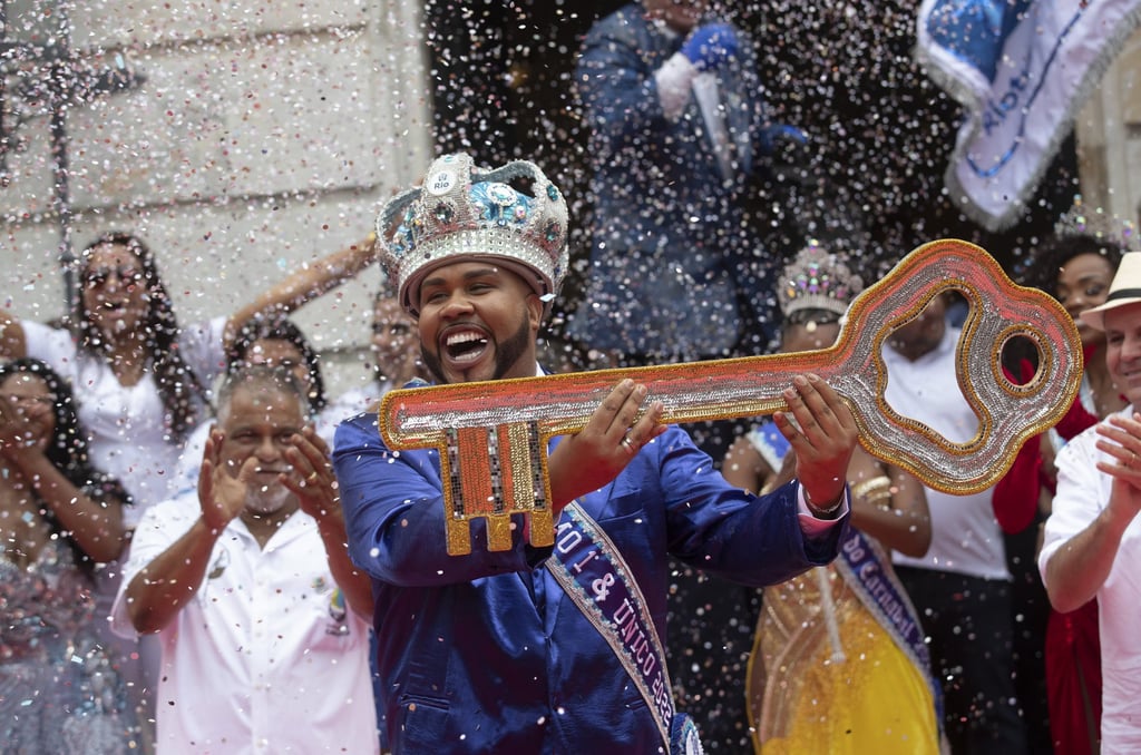 Carnival King Momo, Wilson Dias da Costa Neto, holds the key to the city during a ceremony marking the official start of Carnival in Rio de Janeiro, Brazil. Photo: AP/Bruna Prado
