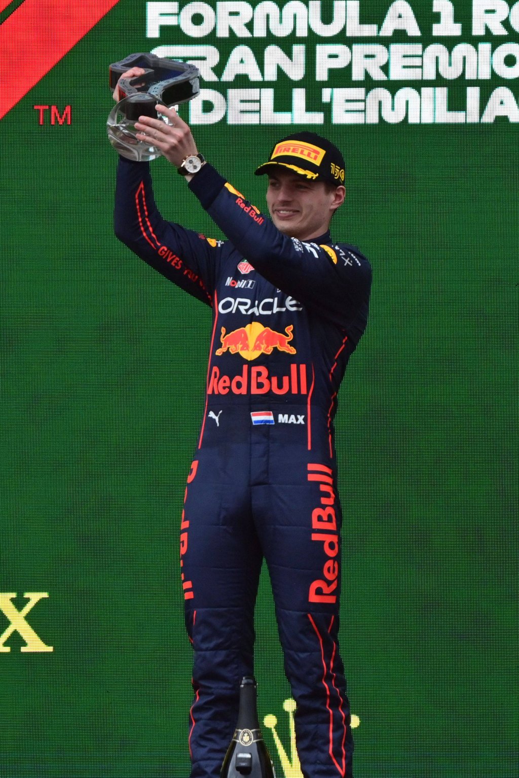 Dutch driver Max Verstappen celebrates his first place win on the podium. Photo: AFP