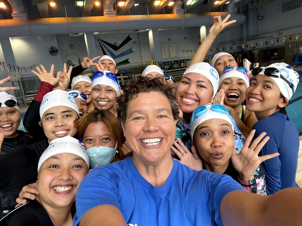 Libby Alexander (centre), co-founder and CEO of Splash Foundation, with some of the Hong Kong residents it has taught to swim. Photo: Splash