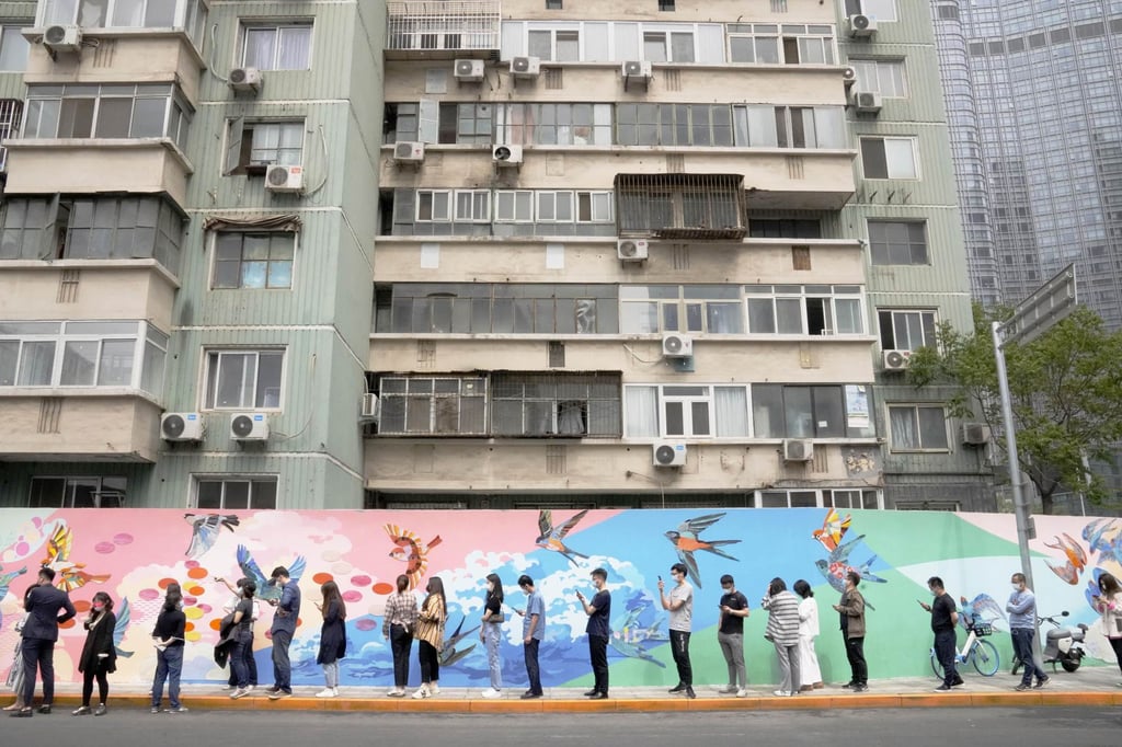 People queue for a PCR test in Beijing as China’s capital is threatened by a Covid-19 outbreak. Photo: Kyodo