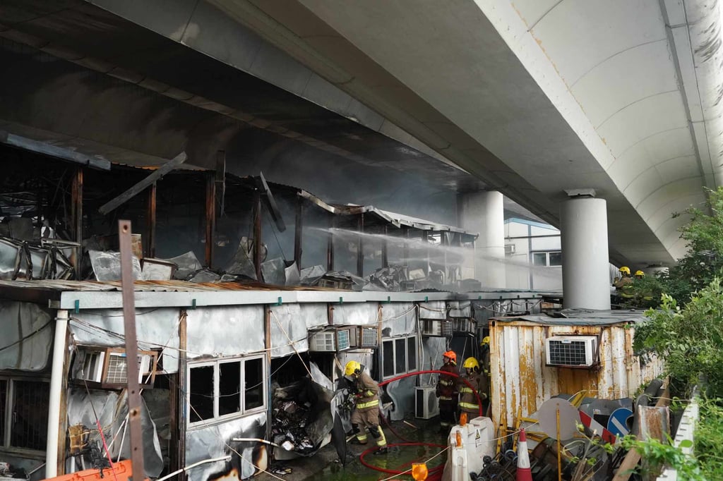 A fire broke out at a two-storey metal structure under the Tsuen Wan Road flyover. Photo: Felix Wong A fire broke out at a two-storey metal structure under the Tsuen Wan Road flyover. Photo: Felix Wong