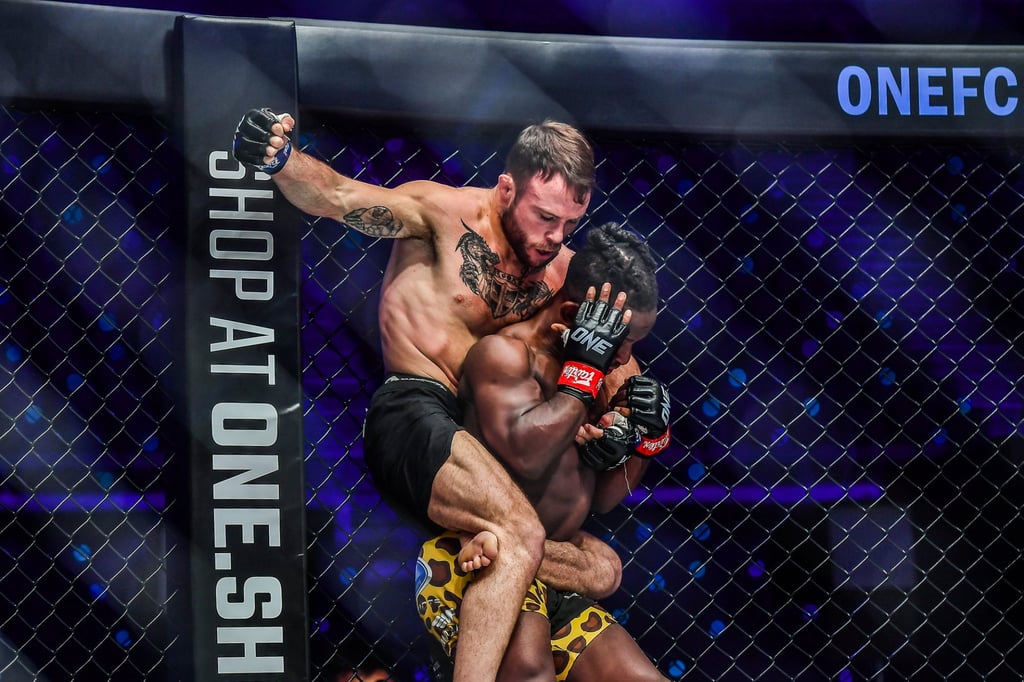 Jarred Brooks throws a punch from back mount in a fight with Bokang Masunyane. Photo: ONE Championship.