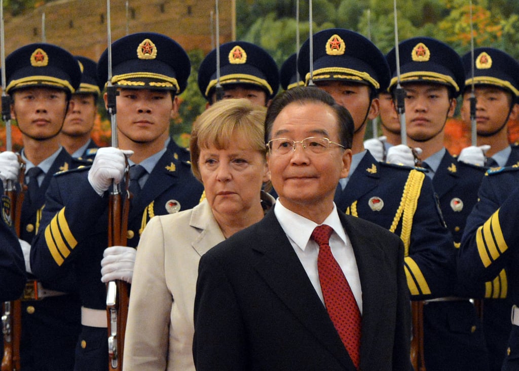 German Chancellor Angela Merkel and Chinese Premier Wen Jiabao review an honour guard during her welcoming ceremony at the Great Hall of the People in Beijing in August 2012. Photo: AFP
