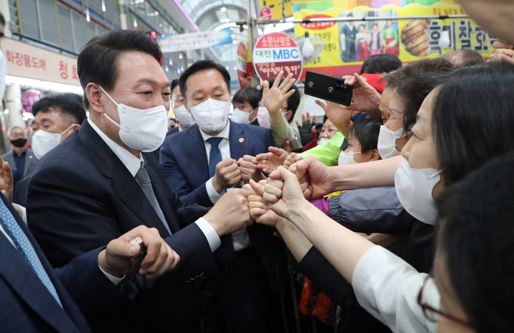 South Korean President-elect Yoon Suk-yeol, left. The decision on masks came just days ahead of his inauguration and despite his team’s opposition. Photo: Yonhap via EPA-EFE South Korean President-elect Yoon Suk-yeol, left. The decision on masks came just days ahead of his inauguration and despite his team’s opposition. Photo: Yonhap via EPA-EFE