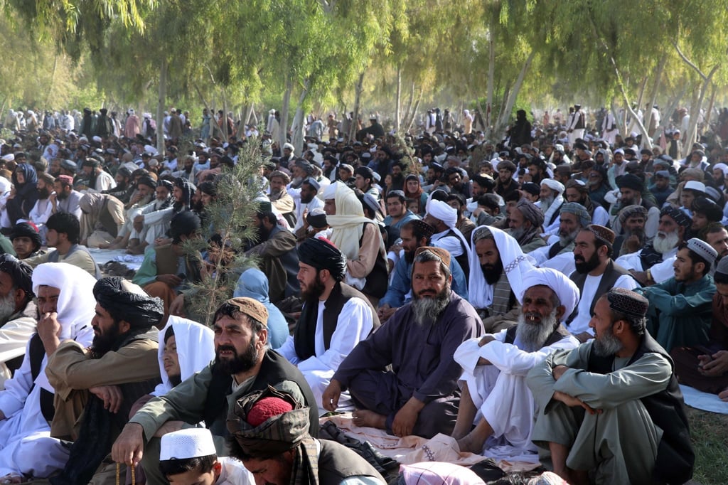 People listen to a speech by Taliban’s leader Hibatullah Akhundzada outside a mosque in Kandahar, Afghanistan, on Sunday. Photo: EPA-EFE