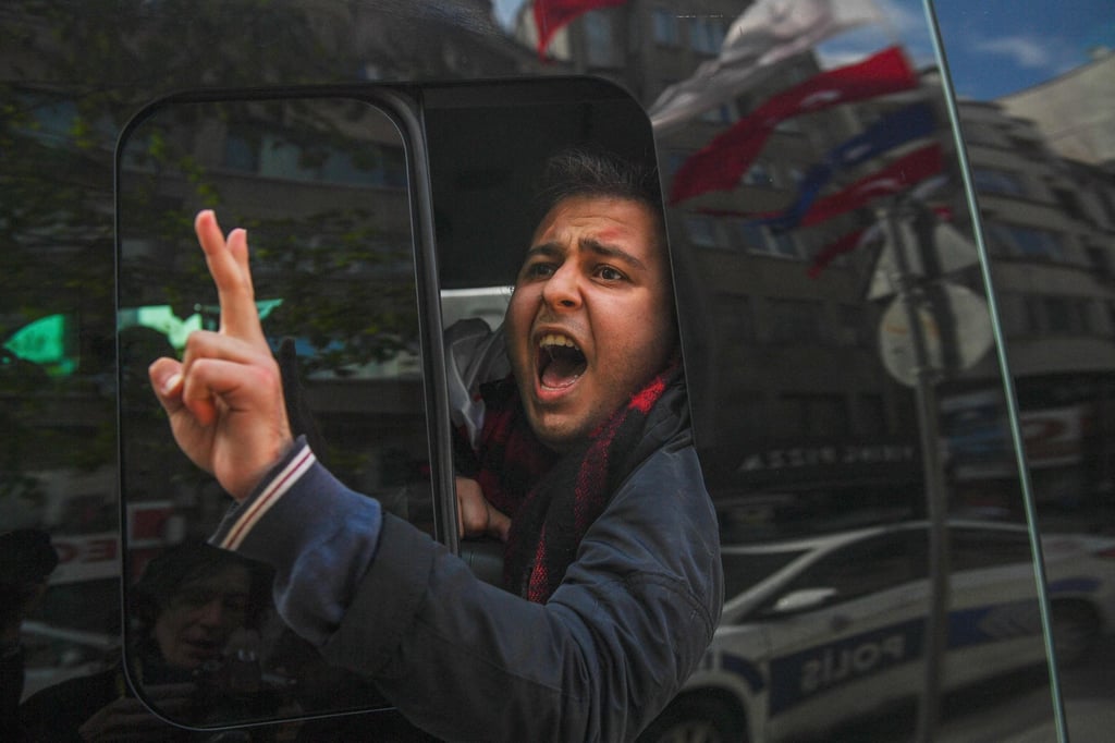 A protester in Istanbul, Turkey, flashes the sign for victory after he was arrested by riot police during the annual May Day demonstrations marking the international day of the workers. Photo: AFP