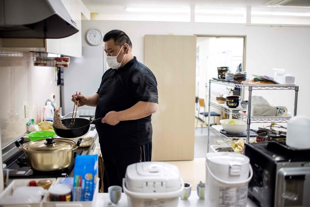 Former wrestler Kamikawa runs two day centres for the elderly, staffed in part by retired rikishi. Photo: AFP Former wrestler Kamikawa runs two day centres for the elderly, staffed in part by retired rikishi. Photo: AFP