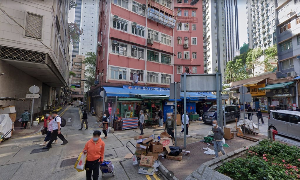 Emergency personnel were called to the store on Cross Street in Wan Chai after the 59-year-old man was found by his business partner. Photo: Handout