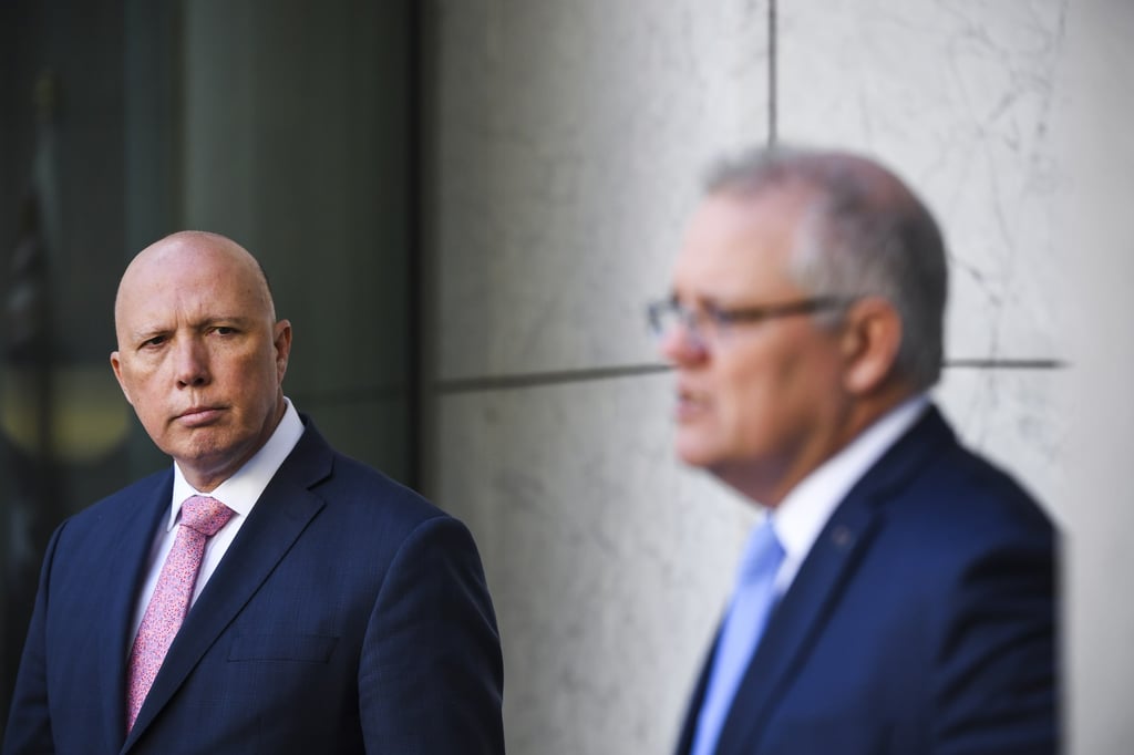 Australian Prime Minister Scott Morrison (right) speaks, accompanied by Minister for Home Affairs Peter Dutton during a press conference at Parliament House in Canberra, Australia. Photo: EPA-EFE