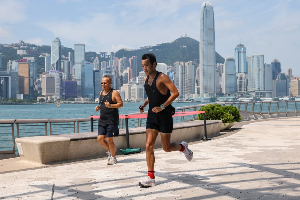 Maskless joggers go for a run along the Tsim Sha Tsui waterfront on Thursday. Photo: Dickson Lee Maskless joggers go for a run along the Tsim Sha Tsui waterfront on Thursday. Photo: Dickson Lee