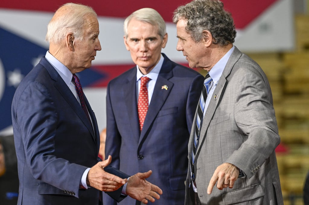 US President Joe Biden, from left, speaks to Senator Rob Portman, a Republican from Ohio, and Senator Sherrod Brown, a Democrat from Ohio, at the United Performance Metals manufacturing facility in Hamilton, Ohio on Friday. Photo: Gaelen Morse/Bloomberg US President Joe Biden, from left, speaks to Senator Rob Portman, a Republican from Ohio, and Senator Sherrod Brown, a Democrat from Ohio, at the United Performance Metals manufacturing facility in Hamilton, Ohio on Friday. Photo: Gaelen Morse/Bloomberg