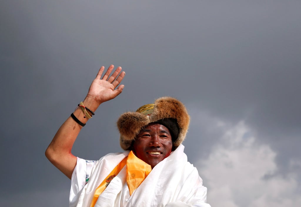 Kami Rita Sherpa, a Nepali mountaineer waves after climbing Mount Everest in May, 2018. The 52-year broke his own record by scaling Mount Everest for a 26th time on Sunday. Photo: Reuters