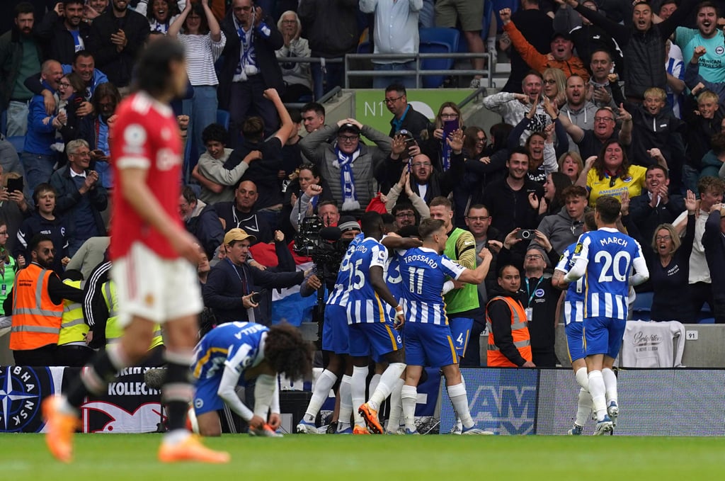 Brighton & Hove Albion celebrate their third goal in a 4-0 rout of Manchester United on Saturday. Photo: AP