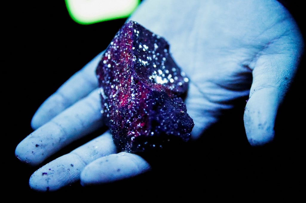 Tungsten is illuminated with a mineral light in Sangdong mine in Gangwon province, South Korea. Photo: Reuters