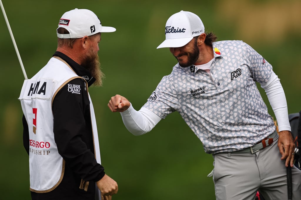 Max Homa celebrates with caddie Joe Greiner after winning the Wells Fargo Championship. Photo: USA TODAY Sports
