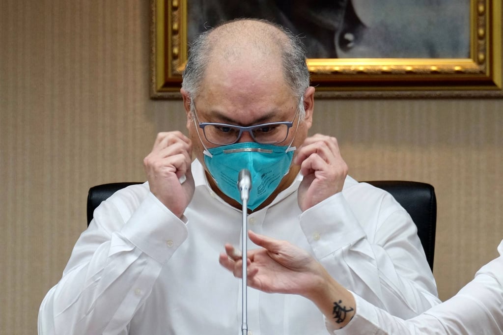 Lee Ming-che adjusts his mask as he takes part in a press conference at the parliament in Taipei on May 10, 2022. Photo: AFP Lee Ming-che adjusts his mask as he takes part in a press conference at the parliament in Taipei on May 10, 2022. Photo: AFP