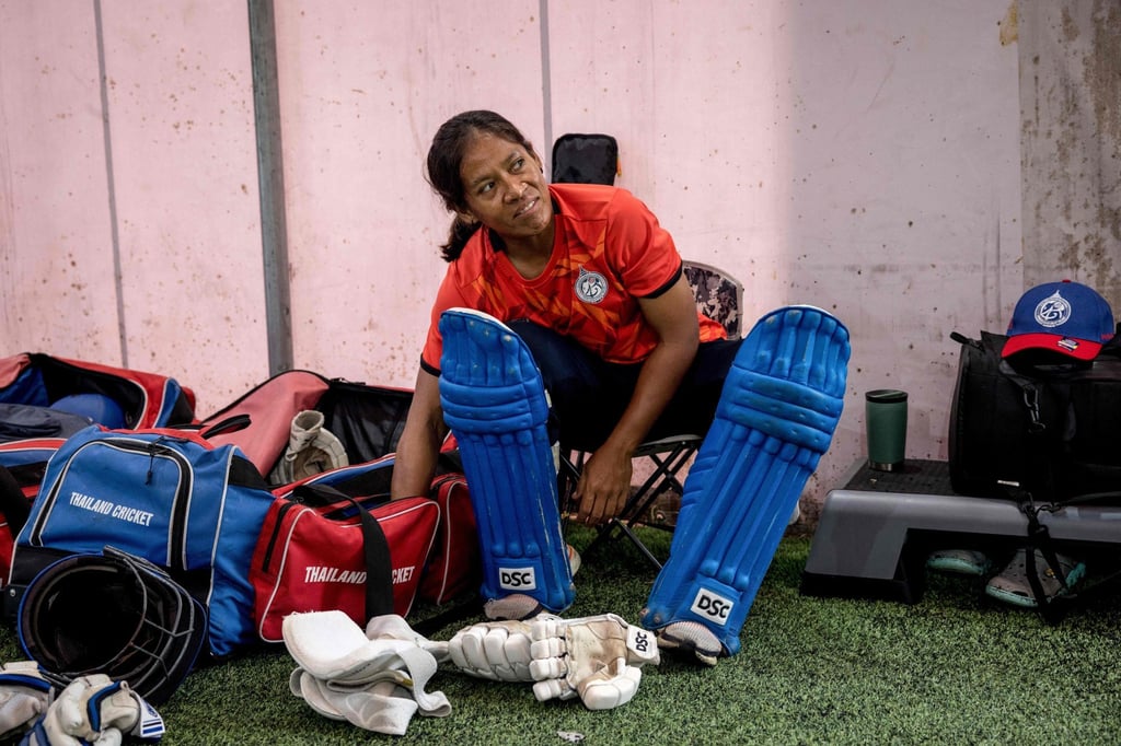Sornnarin Tippoch of Thailand’s women’s national cricket team putting on leg pads during a training session in Bangkok. Photo: AFP Sornnarin Tippoch of Thailand’s women’s national cricket team putting on leg pads during a training session in Bangkok. Photo: AFP