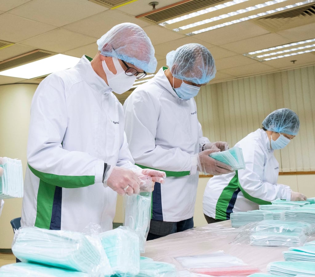 Manulife volunteers pack face masks for donation at the start of the Covid-19 pandemic. Photo: Manulife