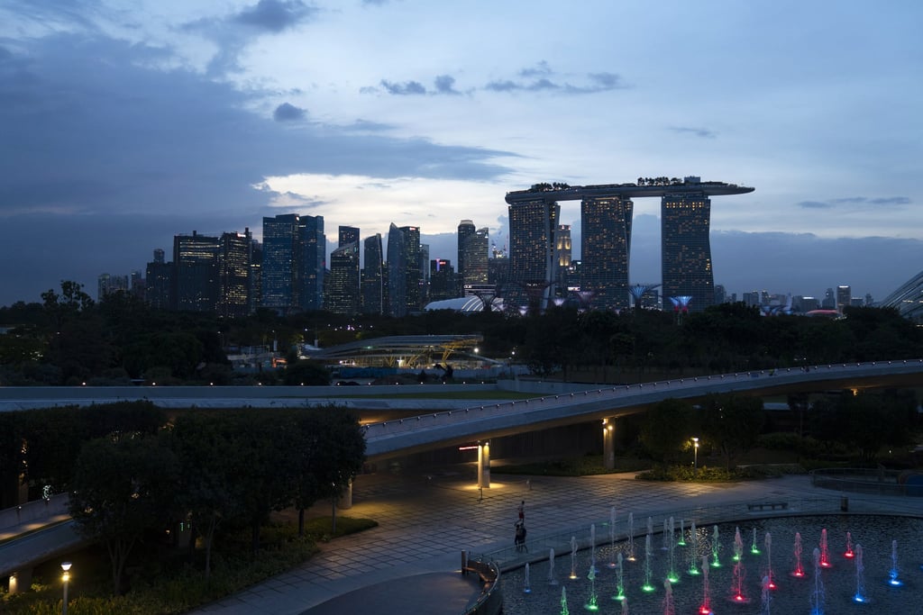 The Marina Bay Sands hotel and casino, right, and other buildings stand beyond the Marina Barrage in Singapore. Rents for Singapore’s private flats and Housing Development Board flats surged to record highs last month, according to local media, and expectations are that they will keep rising. Photo: Bloomberg The Marina Bay Sands hotel and casino, right, and other buildings stand beyond the Marina Barrage in Singapore. Rents for Singapore’s private flats and Housing Development Board flats surged to record highs last month, according to local media, and expectations are that they will keep rising. Photo: Bloomberg