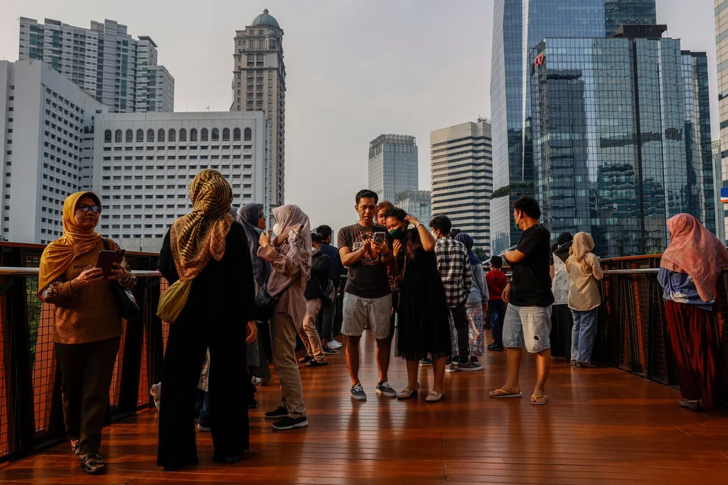 People walk across a bridge in Jakarta. Indonesia has a huge domestic market and youthful talent pool. Photo: EPA-EFE