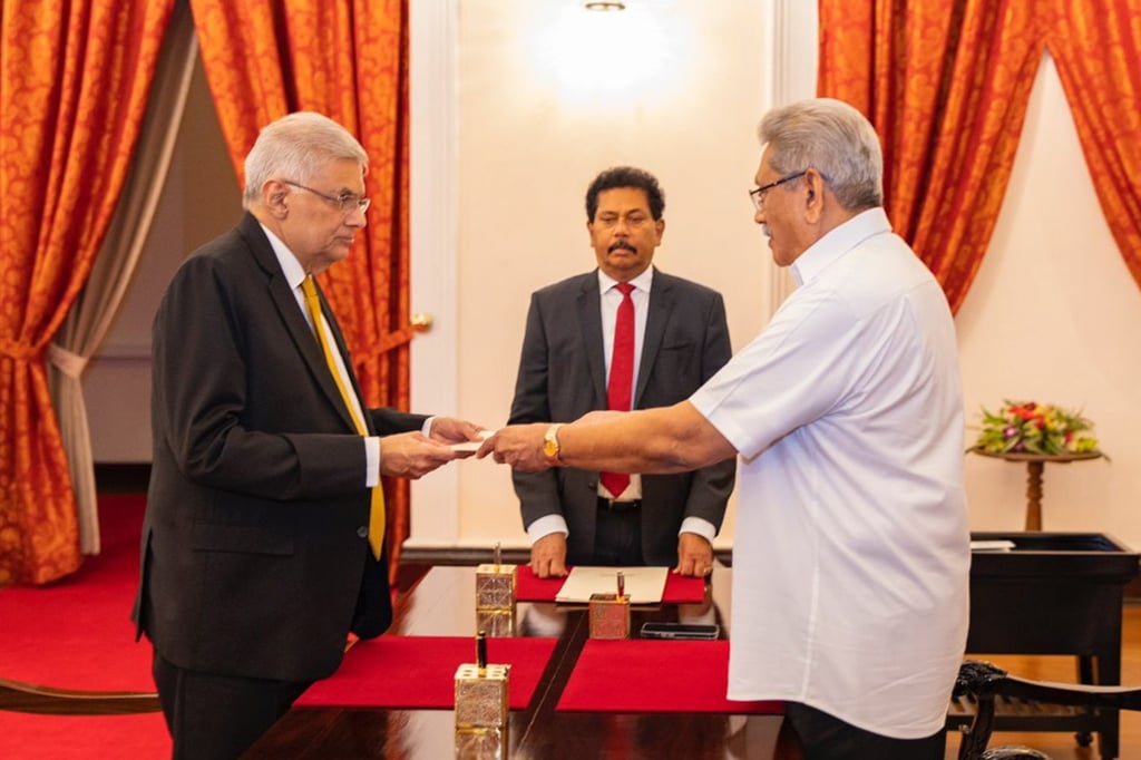 United National Party (UNP) leader Ranil Wickremesinghe (L) takes the oath of office as the 26th prime minister in Sri Lanka before President Gotabaya Rajapaksa (R) at the President’s House in Colombo, Sri Lanka on Thursday. Photo: EPA-EFE/Sri Lankan President handout United National Party (UNP) leader Ranil Wickremesinghe (L) takes the oath of office as the 26th prime minister in Sri Lanka before President Gotabaya Rajapaksa (R) at the President’s House in Colombo, Sri Lanka on Thursday. Photo: EPA-EFE/Sri Lankan President handout