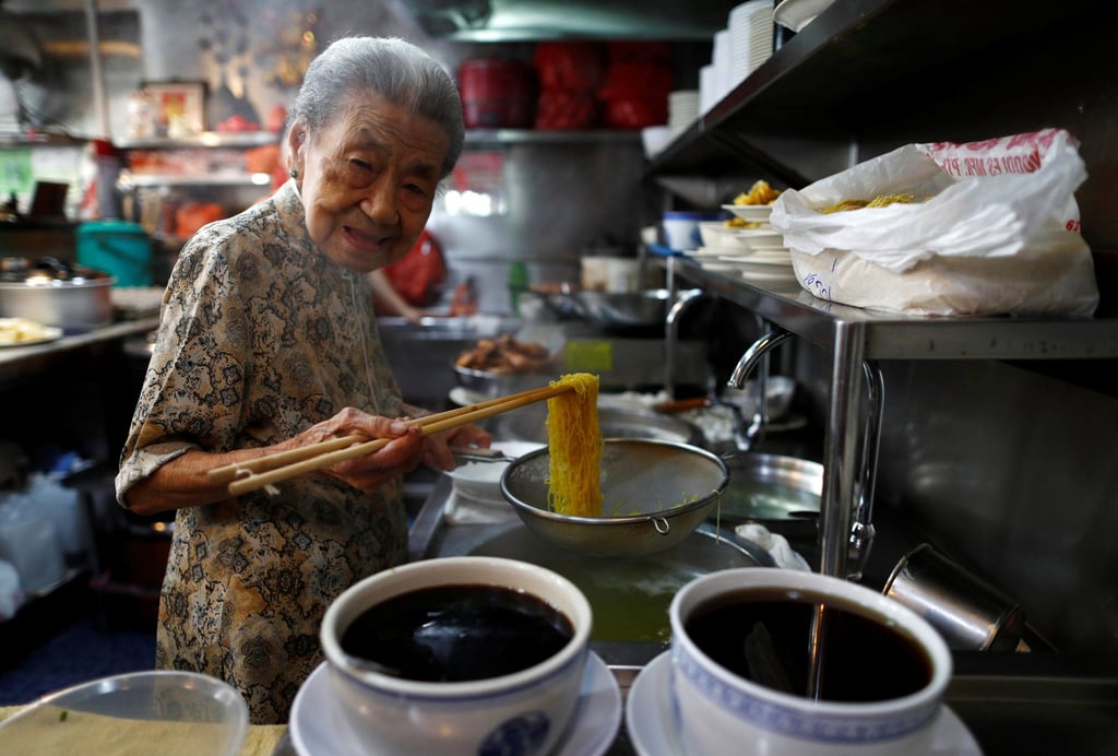 A hawker prepares noodles at her shop in Singapore. The price of wheat flour has increased by up to 15 per cent in recent months. Photo: Reuters A hawker prepares noodles at her shop in Singapore. The price of wheat flour has increased by up to 15 per cent in recent months. Photo: Reuters
