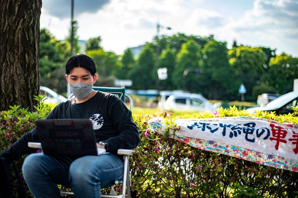 Anti-US military base activist and native Okinawan Jinshiro Motoyama sits during the third day of his hunger strike outside the Ministry of Land, Infrastructure, Transport and Tourism in Tokyo on Wednesday, ahead of the 50th anniversary of the US return of Okinawa to Japan on May 15. Photo: AFP Anti-US military base activist and native Okinawan Jinshiro Motoyama sits during the third day of his hunger strike outside the Ministry of Land, Infrastructure, Transport and Tourism in Tokyo on Wednesday, ahead of the 50th anniversary of the US return of Okinawa to Japan on May 15. Photo: AFP