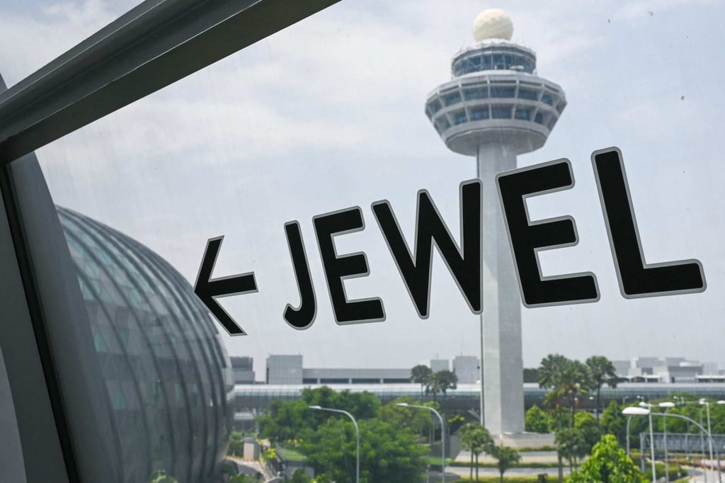 A sign showing the direction to Jewel Changi Airport is displayed on a bridge linking terminals in Singapore. Photo: AFP