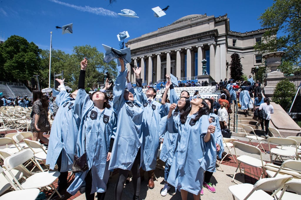 Chinese graduates throw their hats into the air after a commencement ceremony at Columbia University in New York on May 18, 2016. Photo: Xinhua Chinese graduates throw their hats into the air after a commencement ceremony at Columbia University in New York on May 18, 2016. Photo: Xinhua