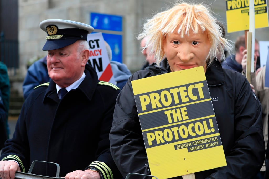 Demonstrators protest outside Hillsborough Castle in Northern Ireland on Monday, ahead of a visit by British Prime Minister Boris Johnson. Photo: AP