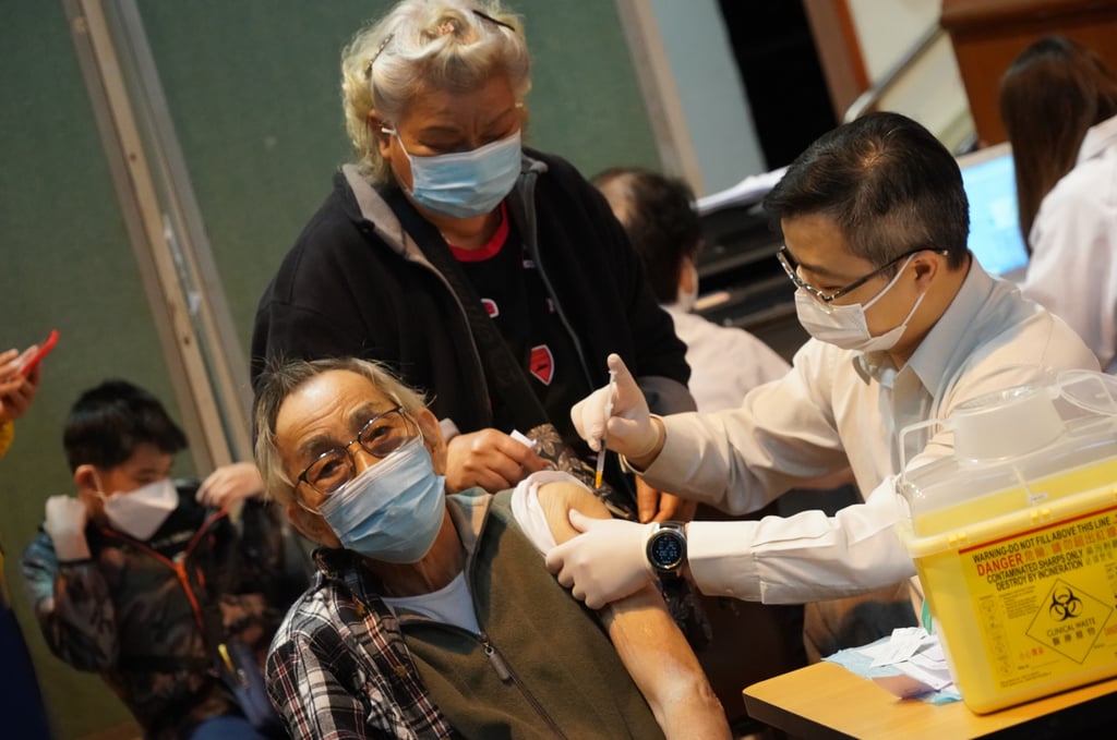 An elderly resident receives a free Covid-19 jab during a vaccination event at a community hall in March. Photo: Felix Wong
