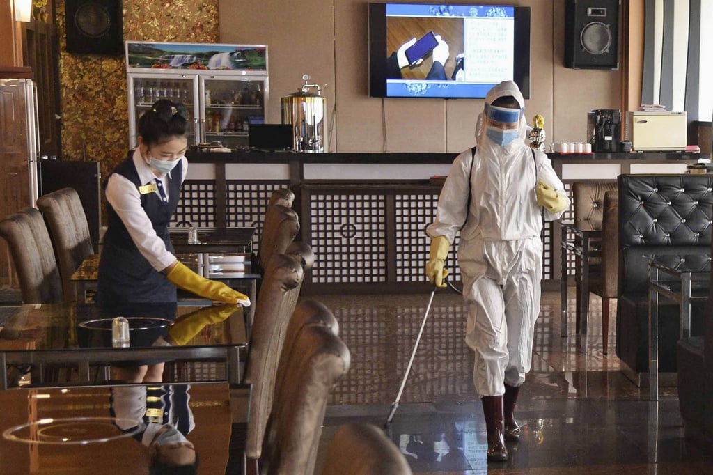 Workers disinfect a restaurant in Pyongyang in March amid worries about the coronavirus. Photo: Kyodo