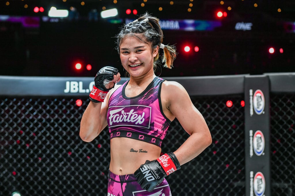 Stamp Fairtex poses after her victory against Julie Mezabarba. Stamp Fairtex poses after her victory against Julie Mezabarba.