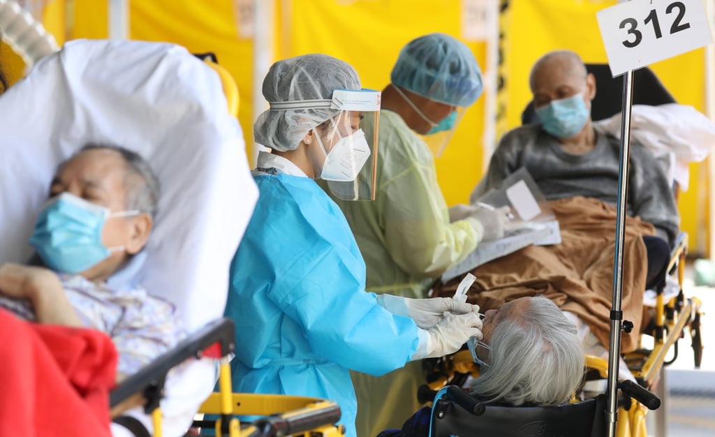 A nurse conducts a rapid antigen test on an elderly patient at the Caritas Medical Centre in Sham Shui Po. Photo: Yik Yeung-man