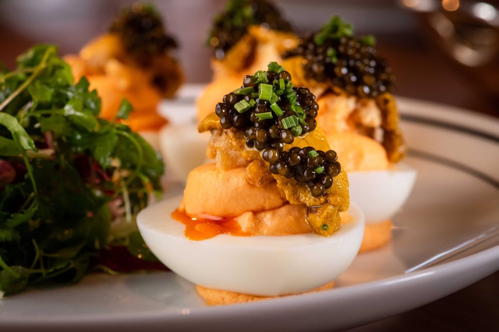 The caviar-topped devilled eggs is a signature dishes at Henry. Photo: Henry