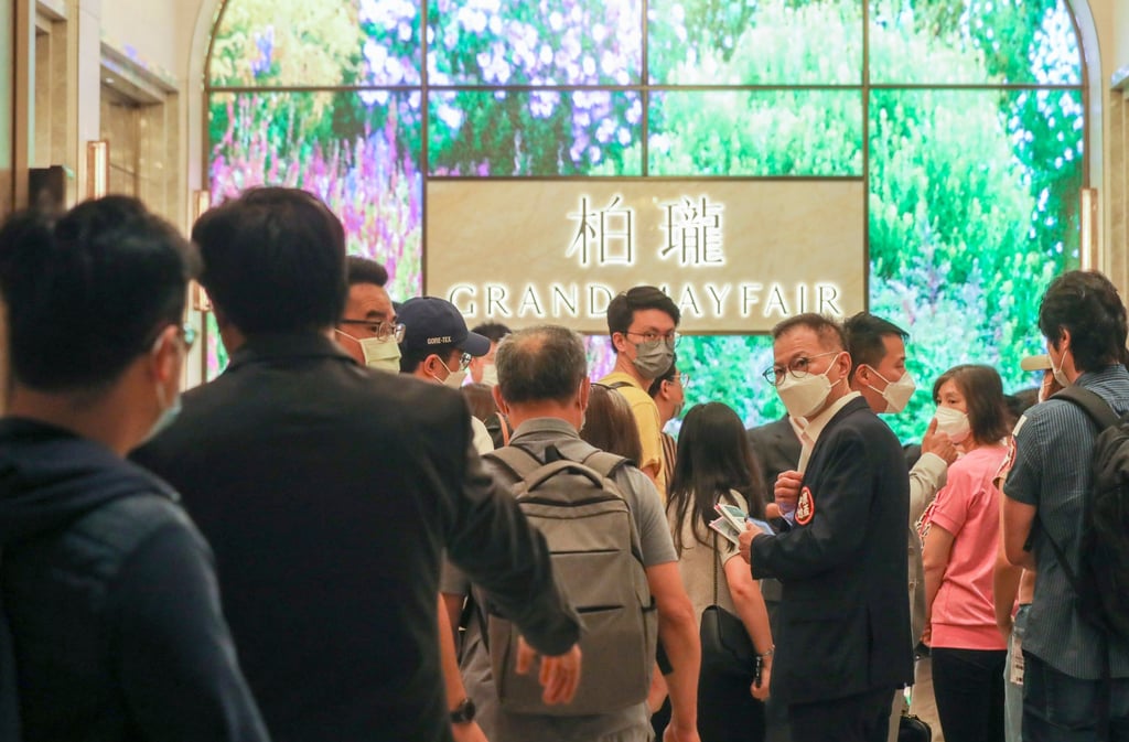 Property buyers waited in line to buy units at Grand Mayfair, a residential development in Yuen Long by Sino Land on May 20, 2022. Photo: Xiaomei Chen Property buyers waited in line to buy units at Grand Mayfair, a residential development in Yuen Long by Sino Land on May 20, 2022. Photo: Xiaomei Chen