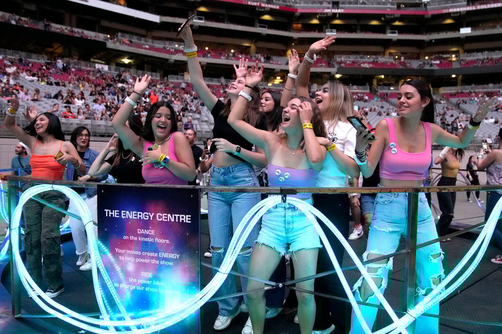 Fans dance on a kinetic dance floor during Coldplay’s Glendale, Arizona concert. Photo: Rick Scuteri/Invision/AP