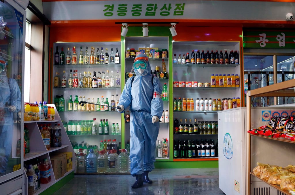 A worker disinfects a shop in Pyongyang last year, before the start of North Korea’s first publicly acknowledged Covid-19 outbreak. Photo: AP