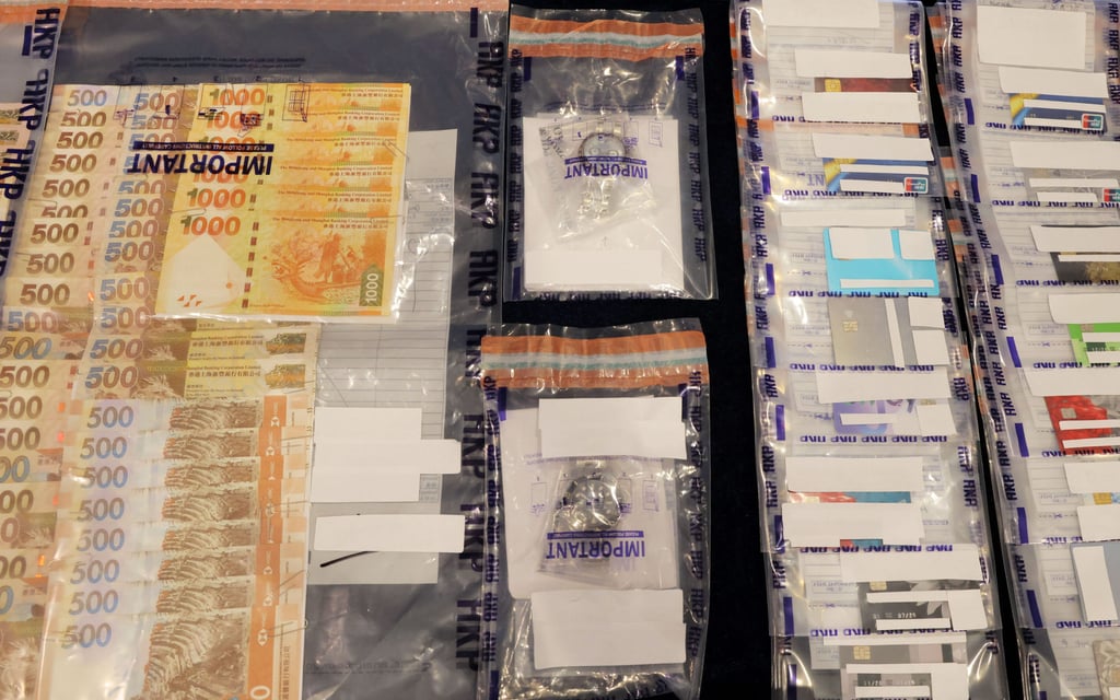 Police arrested 22 people in a crackdown on a cross-border syndicate that laundered HK$2.2 billion. Photo: Jelly Tse Police arrested 22 people in a crackdown on a cross-border syndicate that laundered HK$2.2 billion. Photo: Jelly Tse