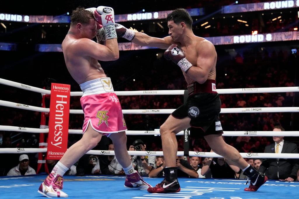 Dmitry Bivol (right) throws a punch against Canelo Alvarez during a light heavyweight title fight in May. Photo: AP