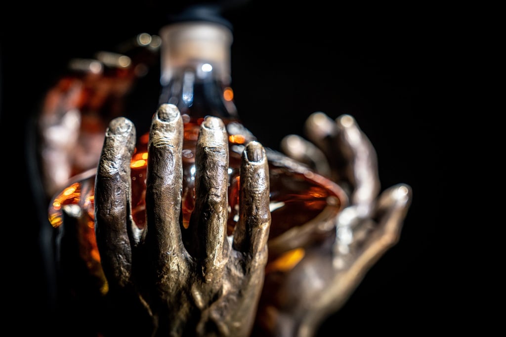 The bronze hands that hold The Reach were created by Scottish sculptor Saskia Robinson, and represent the whisky’s journey from World War II to the present day. Photo: The Macallan The bronze hands that hold The Reach were created by Scottish sculptor Saskia Robinson, and represent the whisky’s journey from World War II to the present day. Photo: The Macallan