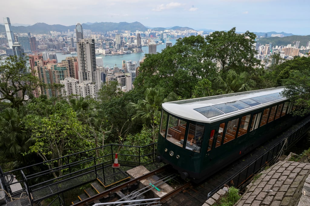 The Peak Tram has had a facelift: the cars have larger windows and doors, and are now painted green. Photo: K.Y. Cheng The Peak Tram has had a facelift: the cars have larger windows and doors, and are now painted green. Photo: K.Y. Cheng