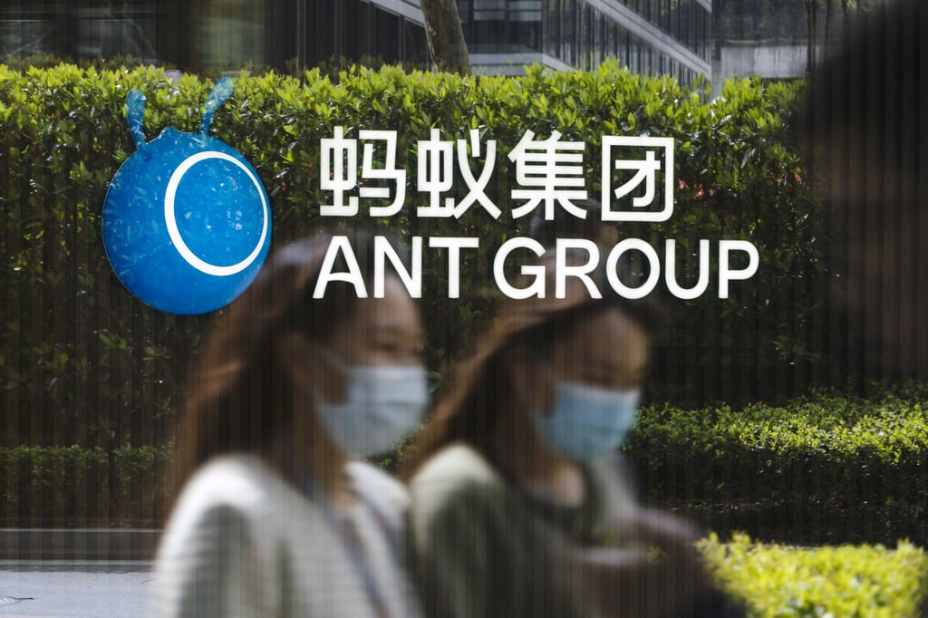 Employees are reflected on a glass panel while walking past a logo at Ant Group headquarters in Hangzhou, China, on March 24, 2021. The suspension of the company’s IPO, and a subsequent regulatory crackdown on consumer-internet firms, reduced investment in the sector. Photo: Bloomberg Employees are reflected on a glass panel while walking past a logo at Ant Group headquarters in Hangzhou, China, on March 24, 2021. The suspension of the company’s IPO, and a subsequent regulatory crackdown on consumer-internet firms, reduced investment in the sector. Photo: Bloomberg