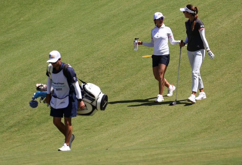 Tiffany Chan (left) and Alison Lee talk while walking the ninth fairway during the second day of round-robin play at Shadow Creek. Photo: AP