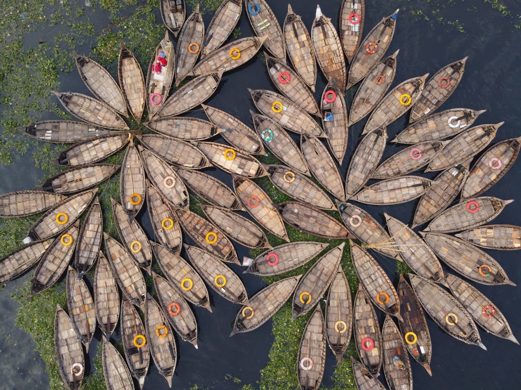 Wooden boats float on the Buriganga River, ready to take workers into Dhaka city centre, on April 20. Photo: Eyepix Group via ZUMA Press Wire/dpa Wooden boats float on the Buriganga River, ready to take workers into Dhaka city centre, on April 20. Photo: Eyepix Group via ZUMA Press Wire/dpa
