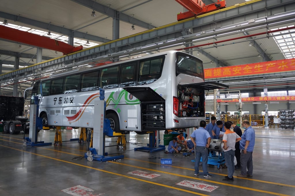 Workers assembled a hydrogen fuel-cell bus at Sinosynergy’s headquarters in Yunfu, Guangdong province, on May 21, 2022. Photo: Yujie Xue