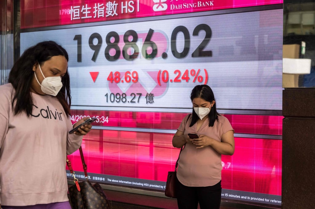 A display shows numbers on the Hang Seng Index in Hong Kong on April 27. Chinese companies now account for 80 per cent of the equities market capitalisation in the city. Photo: AFP A display shows numbers on the Hang Seng Index in Hong Kong on April 27. Chinese companies now account for 80 per cent of the equities market capitalisation in the city. Photo: AFP
