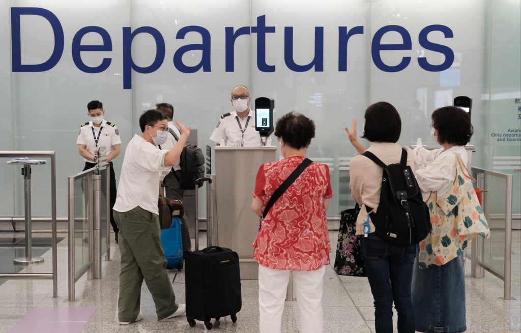 Residents at Hong Kong International Airport leaving the city for London. Photo: Edmond So Residents at Hong Kong International Airport leaving the city for London. Photo: Edmond So