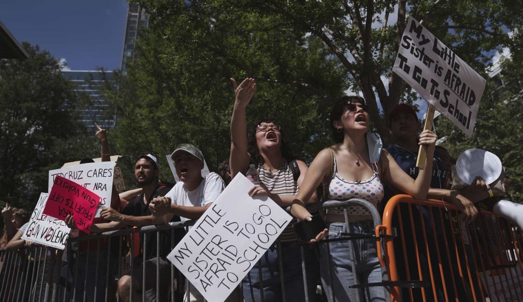 Gun control advocates protest outside the NRA convention venue in Houston, Texas. Photo: Getty Images/AFP