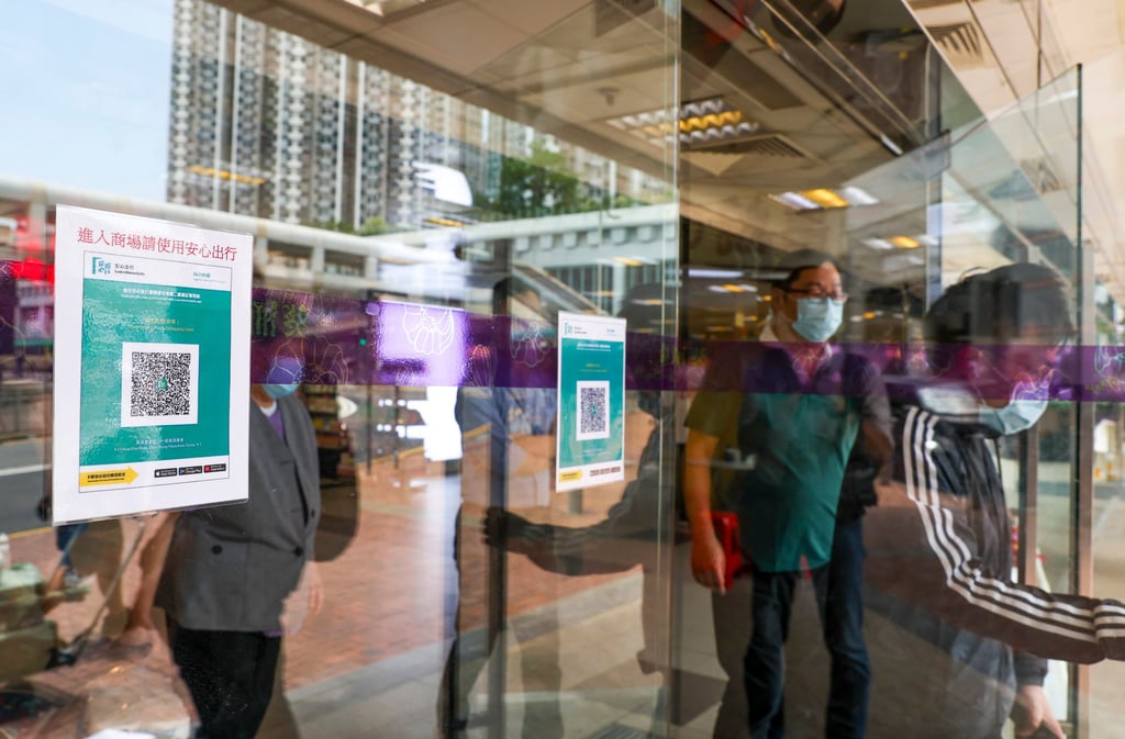 QR codes for the vaccine pass posted at a mall entrance. Photo: Yik Yeung-man QR codes for the vaccine pass posted at a mall entrance. Photo: Yik Yeung-man